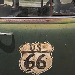 A car marked with a Route 66 sign.