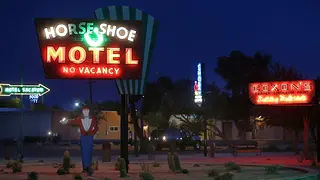 The neon in the park glows brightly into the desert.
