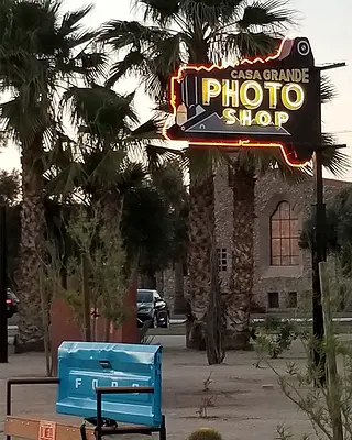 One of the signs in the sign park advertises a now-defunct photo store.